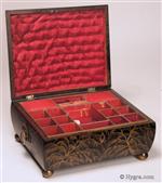 638SB: Delightful Regency fitted sewing box decorated with erudite Chinoiserie images  opening to a  compartmentalized lift out tray .  The  artist who painted the box seems to have an understanding of the symbolism and  style of Chinese Export lacquer. On the  convex sides are depictions of feathery willows. The raised painting on the top depicts figures in a garden. The  box has embossed gilded pressed brass drop ring handles and ball feet.  These are typical of the Regency , Circa 1815.   