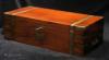 Large military style brass bound solid mahogany writing box of dovetail construction with countersunk brass handles a side document drawer  and secret drawers beneath the pen tray  concealed behind a sprung panel. The box retains its original green baize writing surface.  Beneath the surface there are compartments for  keeping papers. Unusually there is a  tooled leather document wallet, Circa 1810.  