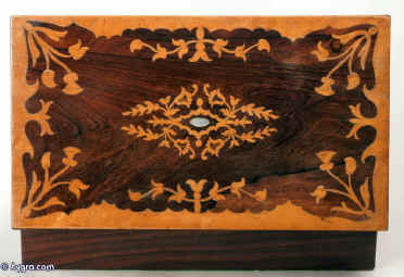 Antique writing box / lap desk, the top and front decorated with marquetry in contrasting rosewood and birds eye maple  depicting stylized themes from nature, opening down to reveal a green baize  velvet writing surface and compartments for pens and writing instruments. There are compartments for holding paper under the flaps. Circa 1840