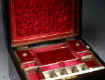 SB124: Victorian figured coromandel sewing box  with mother of pearl cartouche and escutcheon, the inside with fitted liftout tray  with silk covered supplementary lids, Circa 1860.   Enlarge Picture