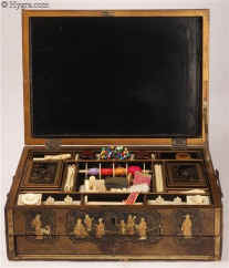 SB498: An early 19th Century  fully fitted Chinese export lacquer combined sewing and writing box of rectangular form opening to a fully fitted sewing tray with turned and carved ivory tools and having a drawer fitted for writing. Circa 1800  Enlarge Picture