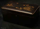  TC565: Japanese Export lacquer tea chest with raised gilded lacquer depicting birds and insects in  watery backgrounds.Inside there are two foil lined canisters their hinged lids decorated with exquisite depictions of insets, again in raisedlacquer. The inside of the chest is in red lacquer sprinkled with gold powder,  <i>nashiji. </i>Circa 1880 Enlarge Picture