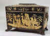 A fine Regency two compartment Penwork Tea caddy decorated all over with exotic penwork scenes on a sycamore ground  and standing on embossed gilded brass paw feet.